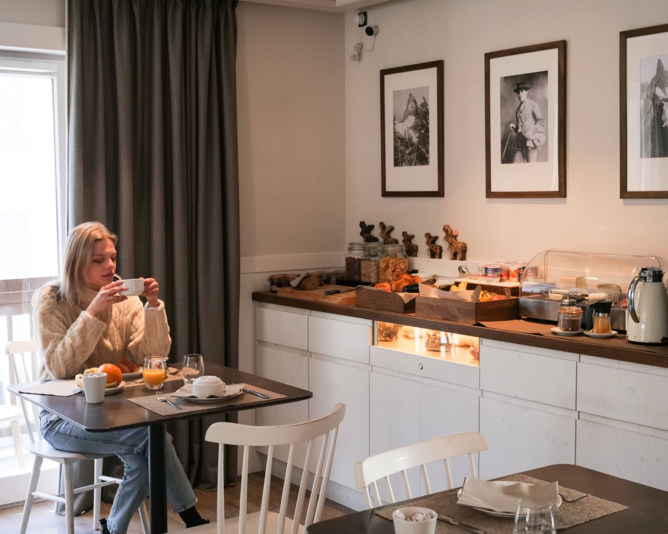 woman enjoys continental breakfast buffet Chalet Whymper