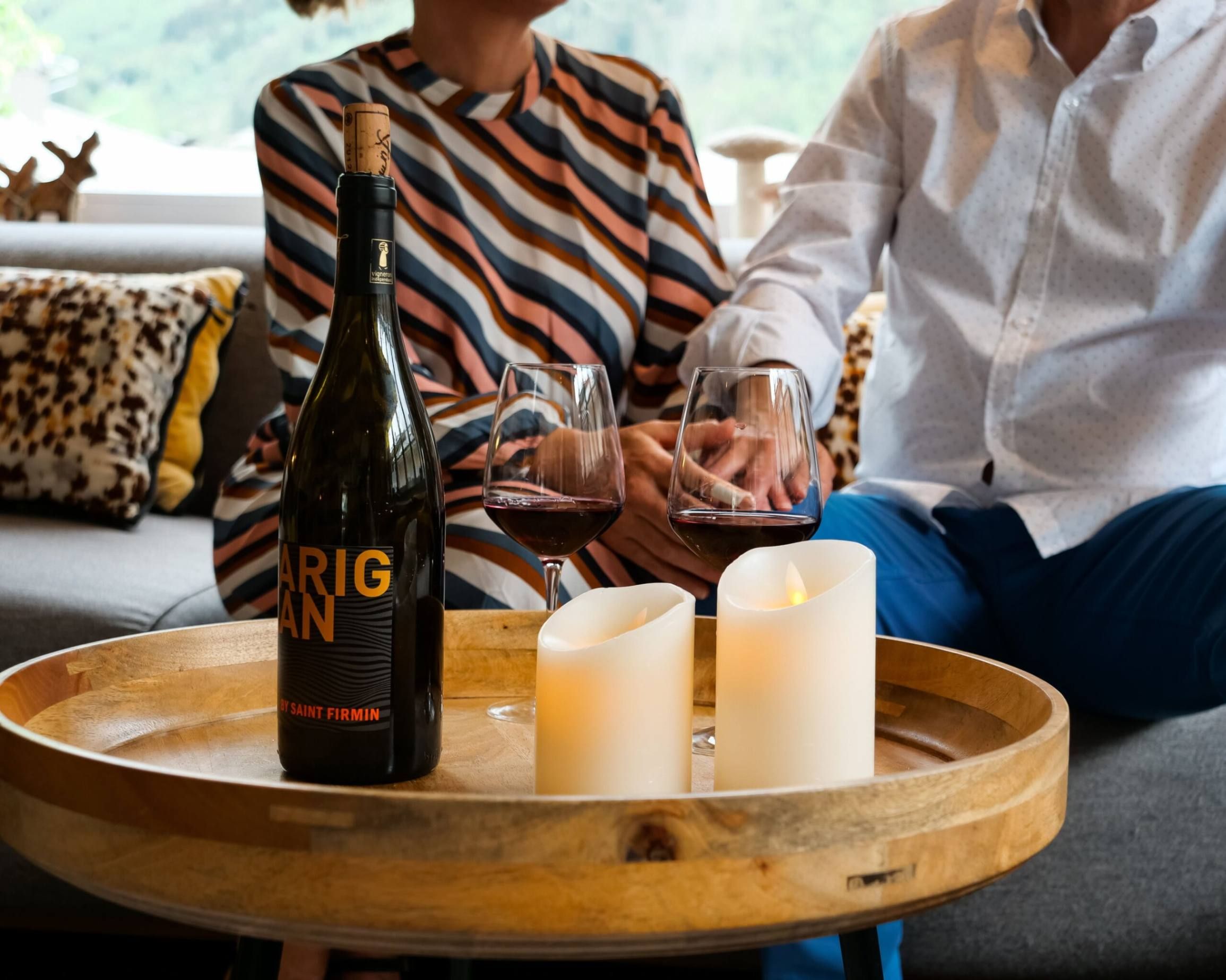 Couple drink wine in the chalet Whymper Lounge