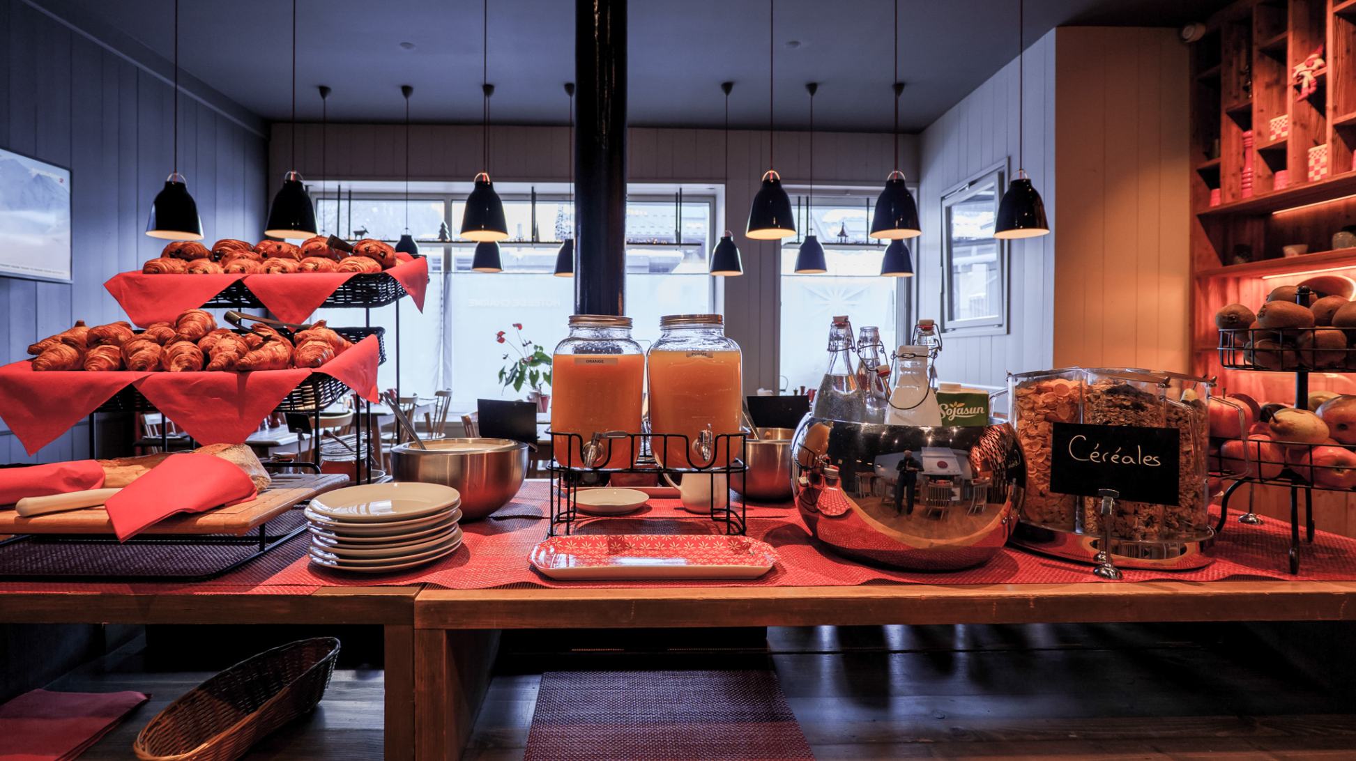 pastries, orange juice, fruit on the continental buffet