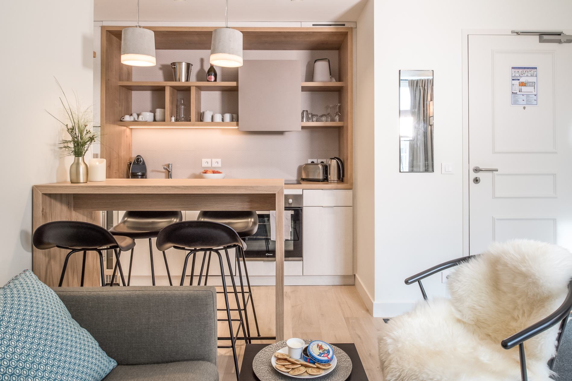 equipped kitchen and living room with sofa bed