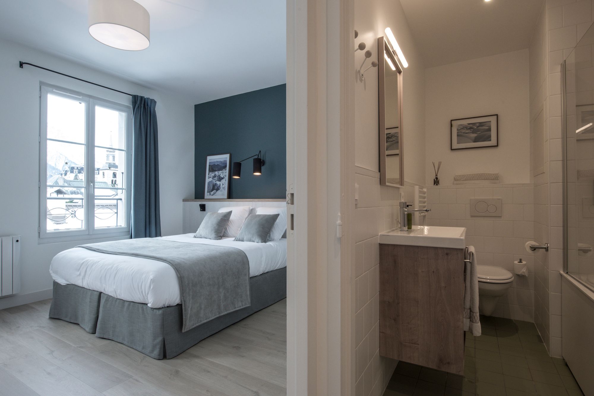 comfortable double bedroom with bathroom and bathtub