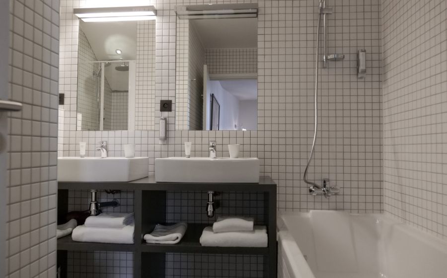 red teddy bear in a child's hands