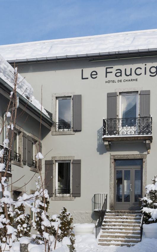 Flower-filled entrance to Le Faucigny hotel in spring