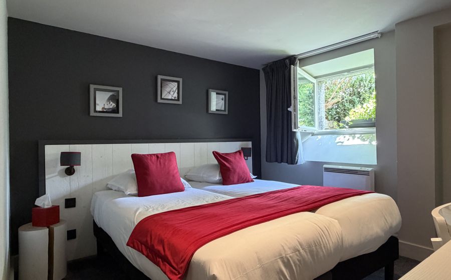 Woman reading on a white bed in a comfort bedrooms